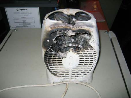 Damaged fan heater following fire