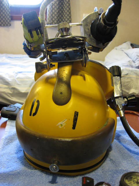 Diver's hat with the indentation where valve hit the hat