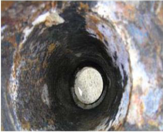 The surface of the inner cone was corroded and rough, although loose rust was removed