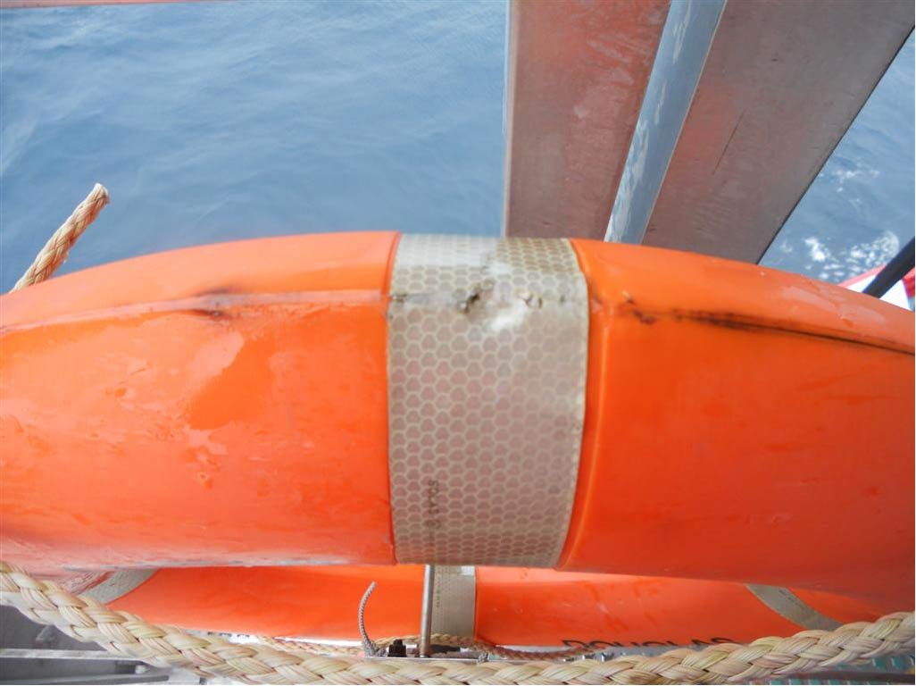 Lifebuoy plug/stopper insert location covered by retro-reflective tape