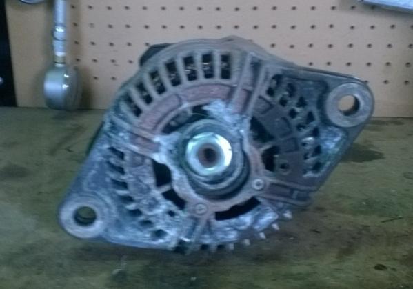 Damaged alternator with shaft out of alignment due to bearing collapse