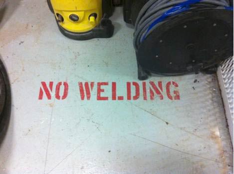 'No welding' marking which was covered over