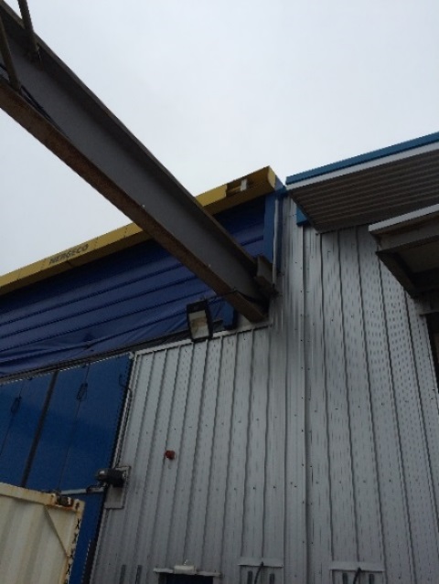 Item dropped approximately 7-10 metres from above the main roller shutter door